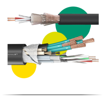 A picture with a white background showing our bulk cables in the middle. Three dots in yellow, light green and dark green can be seen in the background